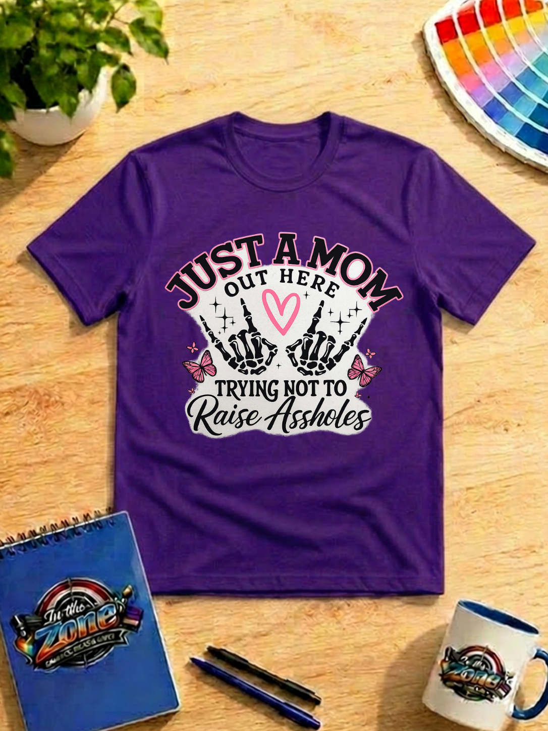 Just a Mom Out Here Trying Not to Raise Assholes Funny Mom Graphic Shirt