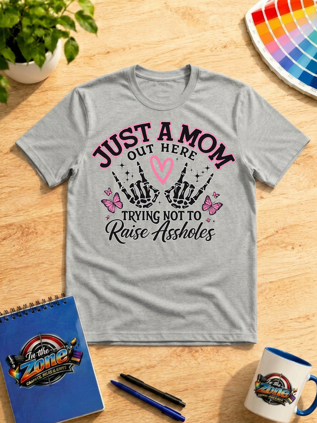 Just a Mom Out Here Trying Not to Raise Assholes Funny Mom Graphic Shirt