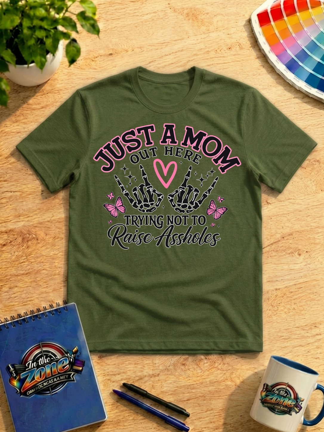 Just a Mom Out Here Trying Not to Raise Assholes Funny Mom Graphic Shirt