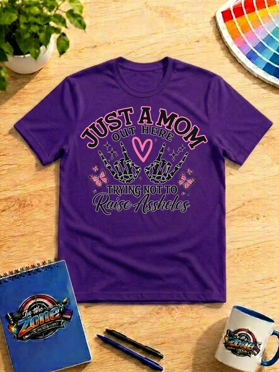 Just a Mom Out Here Trying Not to Raise Assholes Funny Mom Graphic Shirt
