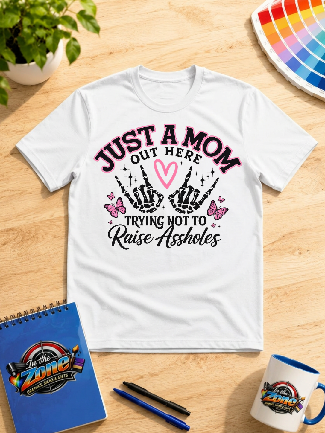 Just a Mom Out Here Trying Not to Raise Assholes Funny Mom Graphic Shirt
